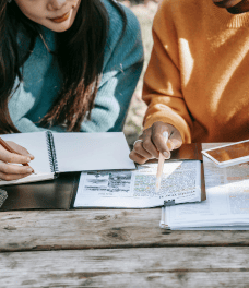 Two woman discussing their study